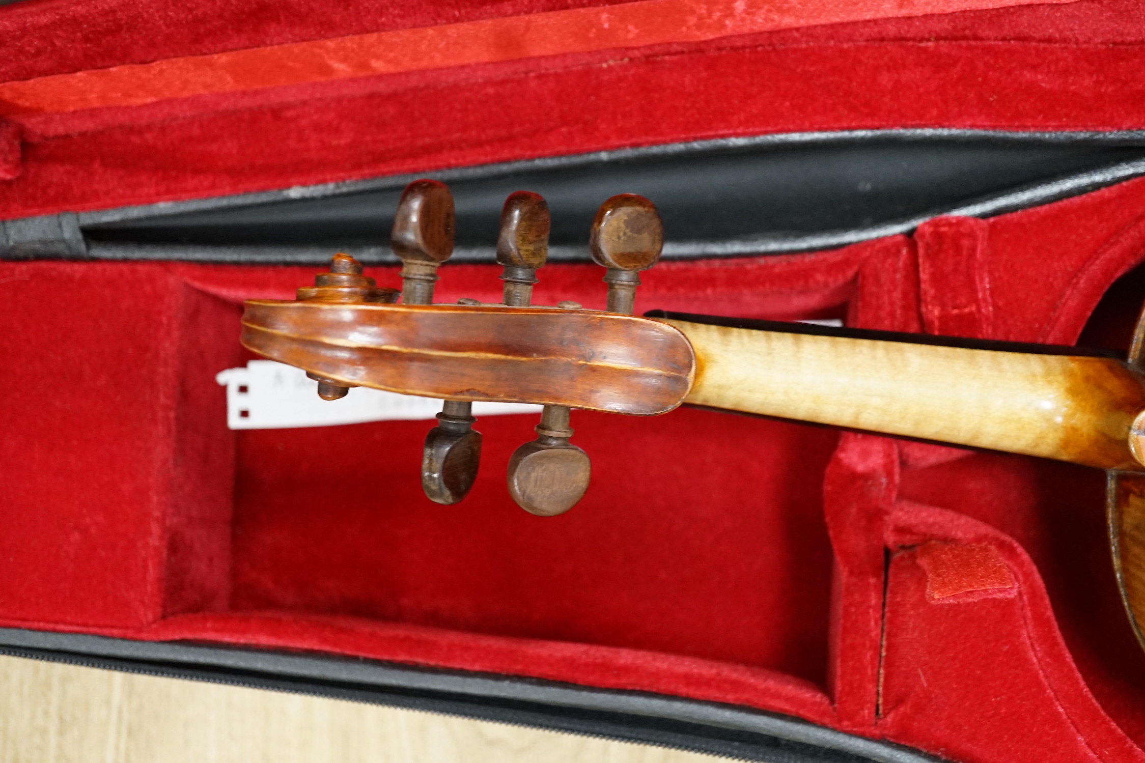 An unusual late 17th century and later cased Quinton (five string violin/viola), with early body with 18th/19th century neck and scroll, tuned for C, G, D, A, E, length of body 36.5cm, without bow
